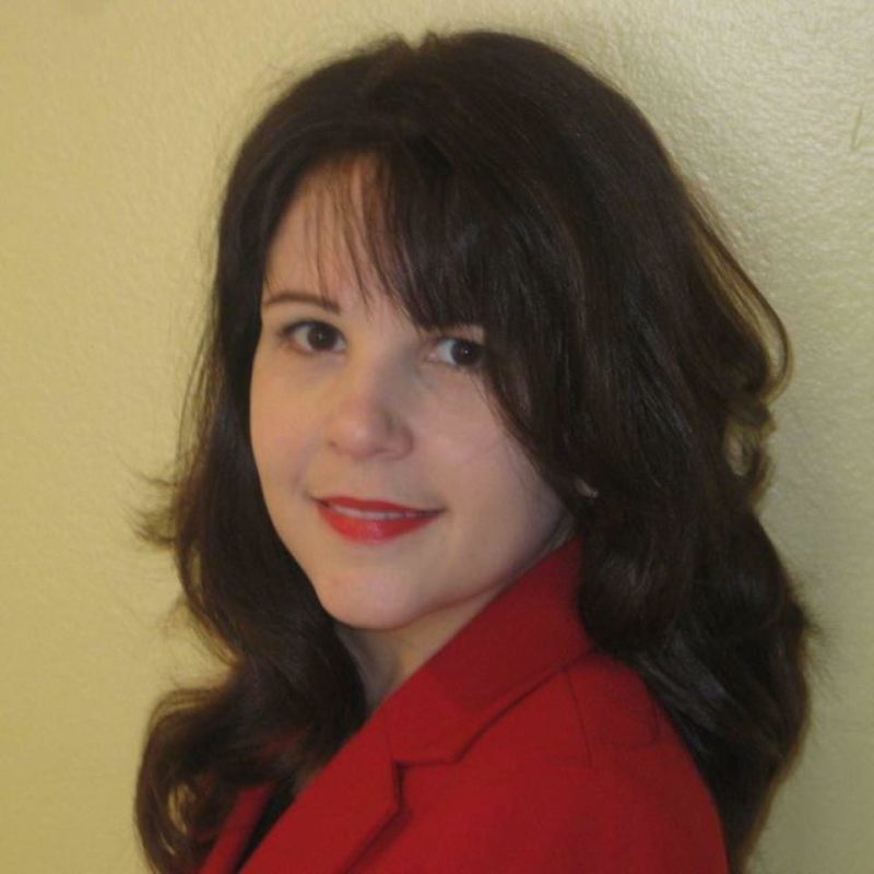 Female in red smiling