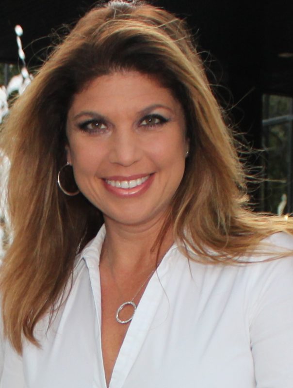 Female in white smiling